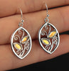 Golden Colored Studdend Stone Floral Earrings